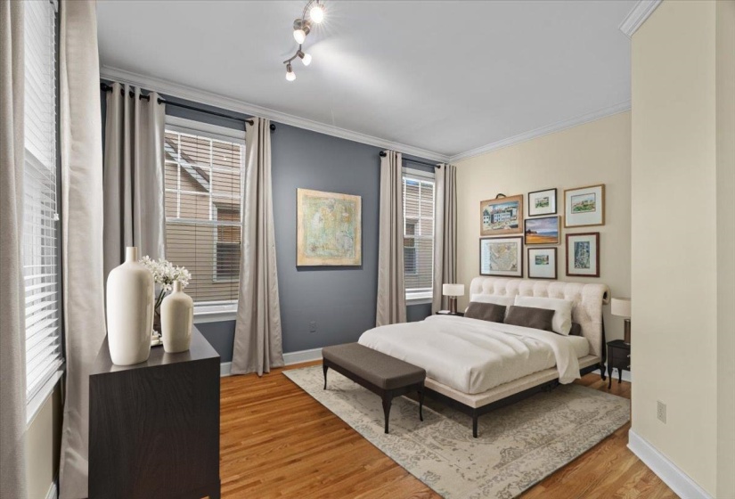 Bedroom featuring crown molding and light wood finished floors