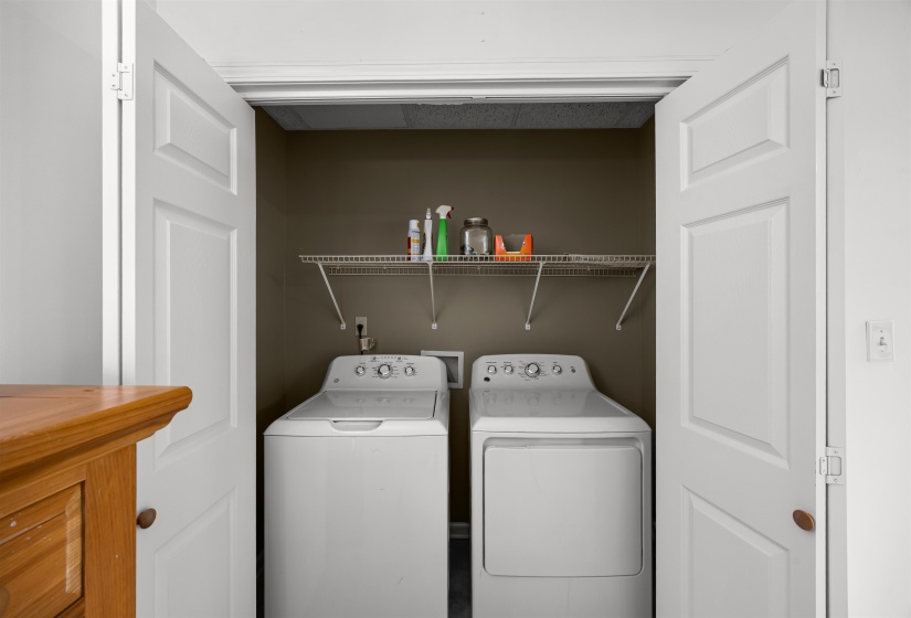 Washroom featuring washing machine and clothes dryer