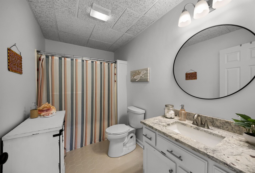 Full bathroom featuring vanity, light tile patterned floors
