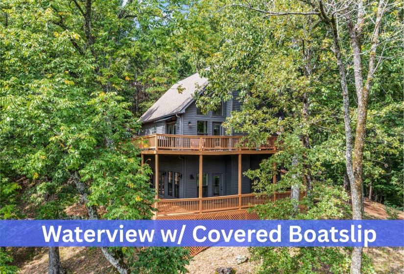Back of property featuring a wooden deck