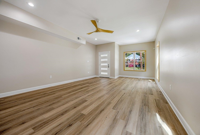 Spare room with light wood finished floors, recessed lighting, and a ceiling fan