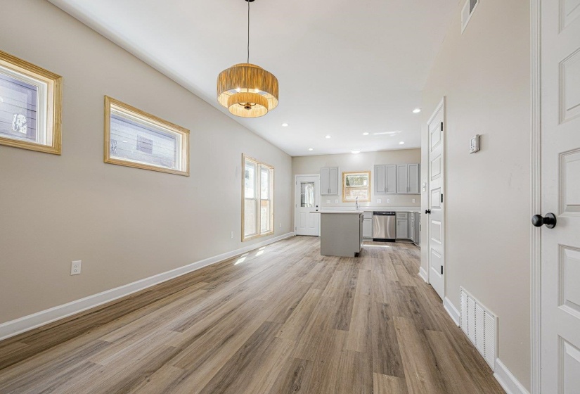 Unfurnished dining area with recessed lighting and light wood-style flooring