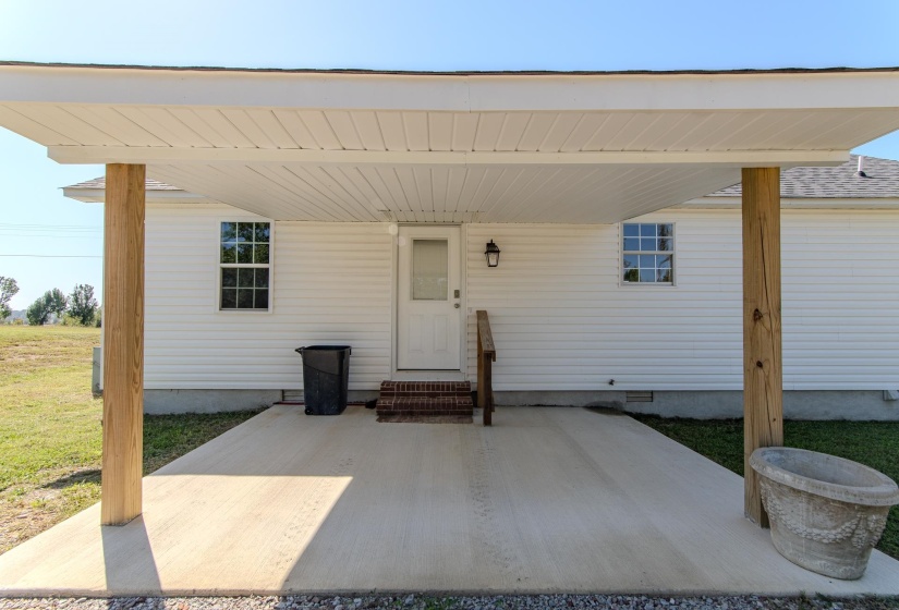 View of exterior entry with crawl space
