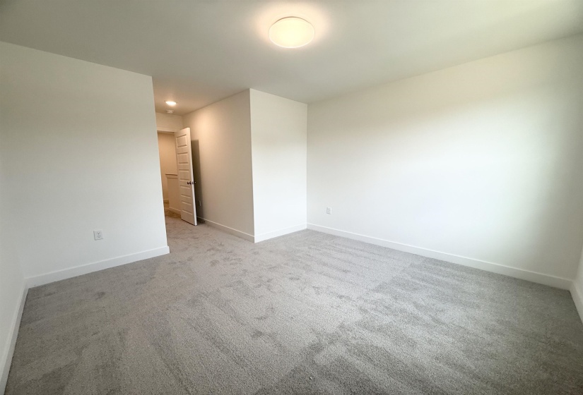 Empty room featuring carpet floors and recessed lighting