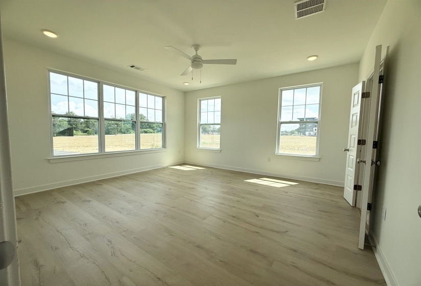 Spare room with ceiling fan, wood finished floors, and recessed lighting
