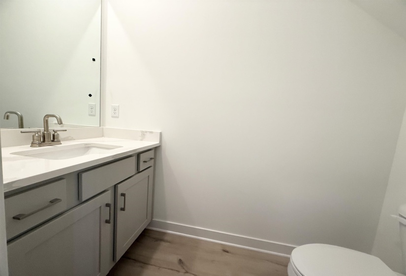 Bathroom with vanity and wood finished floors