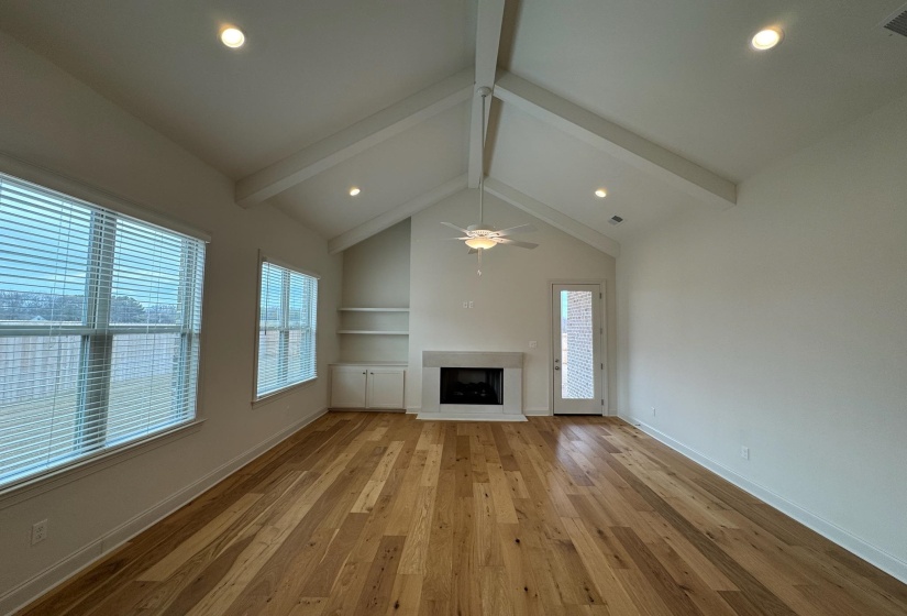 Unfurnished living room with a fireplace, light wood-style flooring, recessed lighting, and ceiling fan