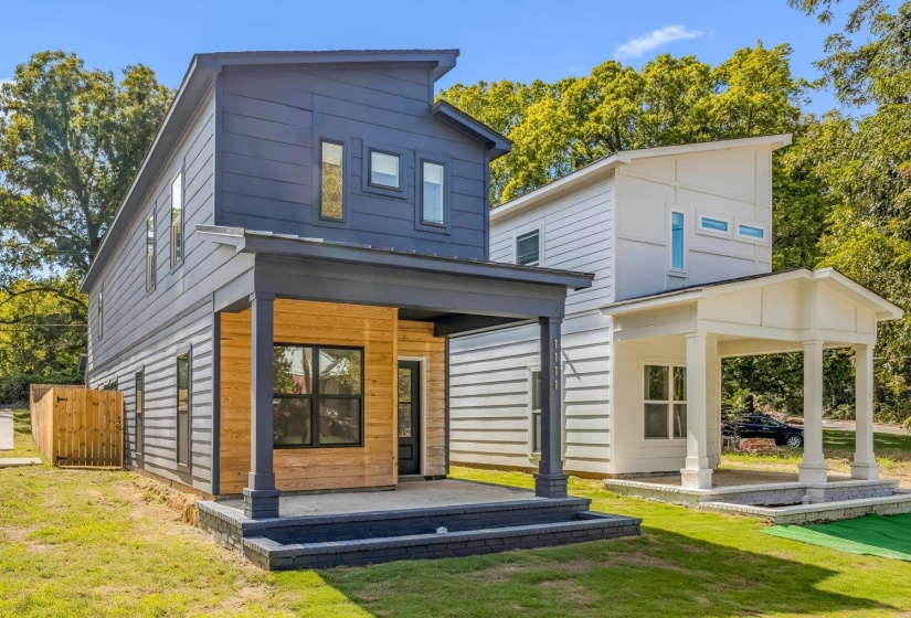 Rear view of house featuring a lawn and a patio area