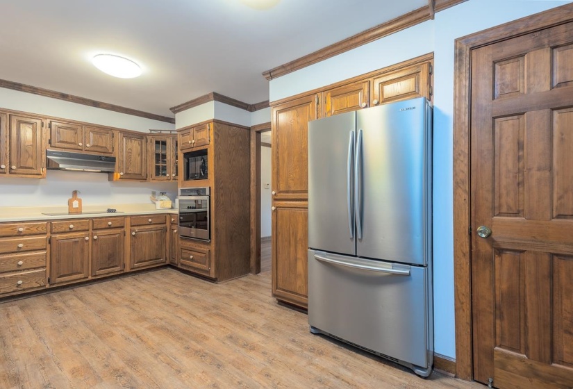 Stainless refrigerator stays with house