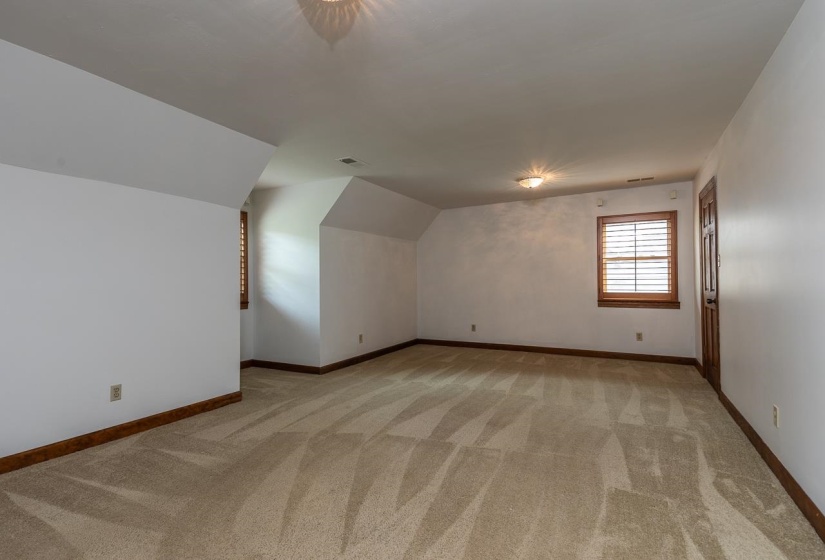 One of the 2 bedrooms upstairs. Has a huge closet the length of the room.
