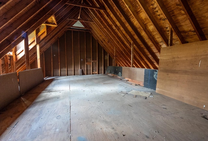 View of floored attic storage in garage - permanent walk-up stairs