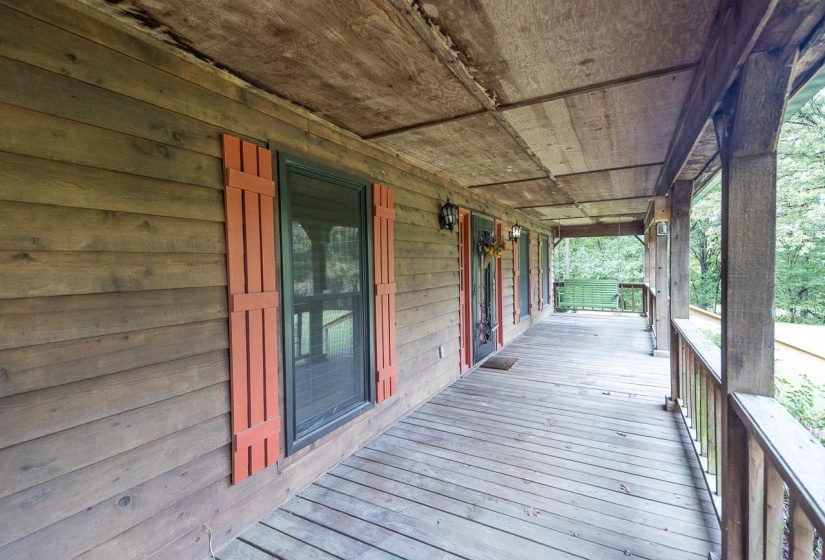Enjoy the beautiful scenery from your 2  swings on the massive 50' front porch!