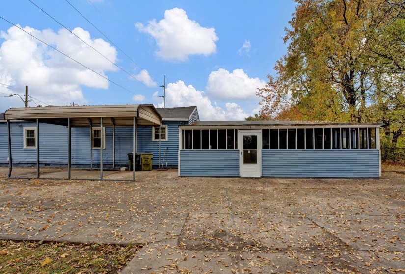 View of front of property with a sunroom