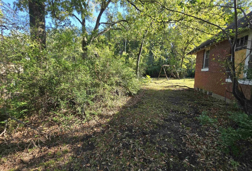 View of yard with a forest view