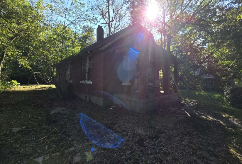 View of side of property featuring a chimney