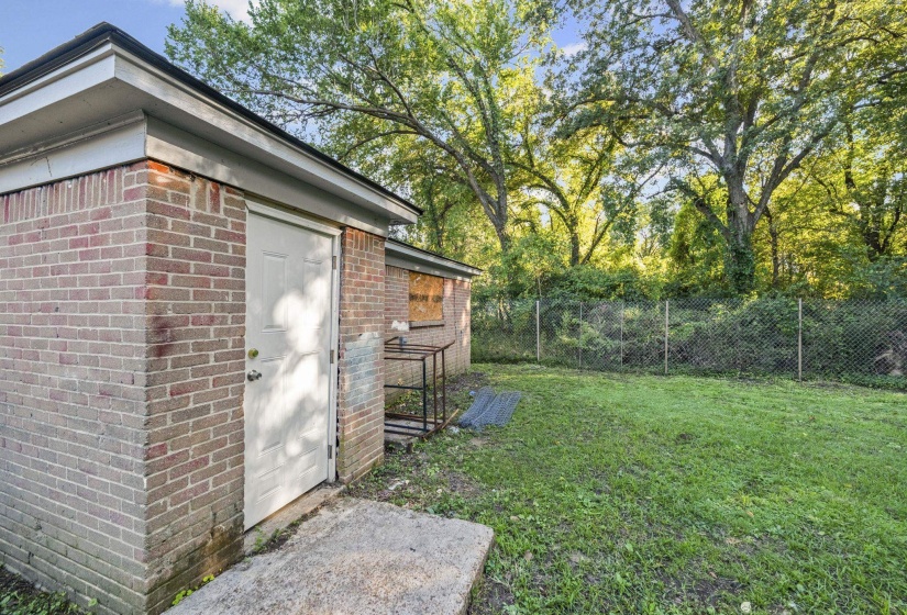 View of outbuilding featuring a fenced backyard