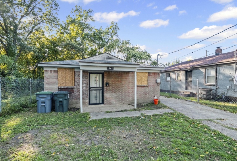 View of front of house with brick siding