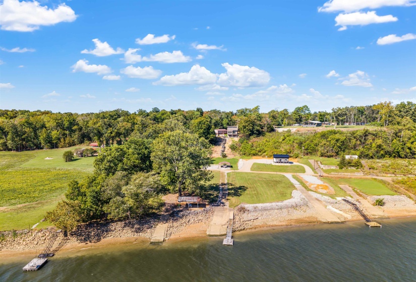 Aerial view of a large body of water and a tree filled landscape