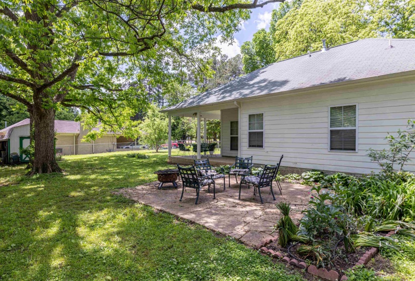 View of yard featuring an outdoor fire pit and a patio