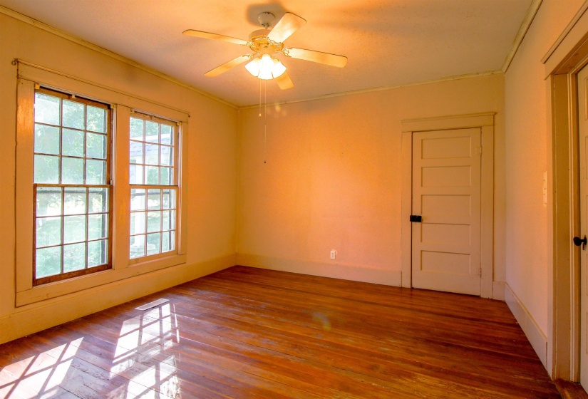 Bedroom featuring original hardwood floors