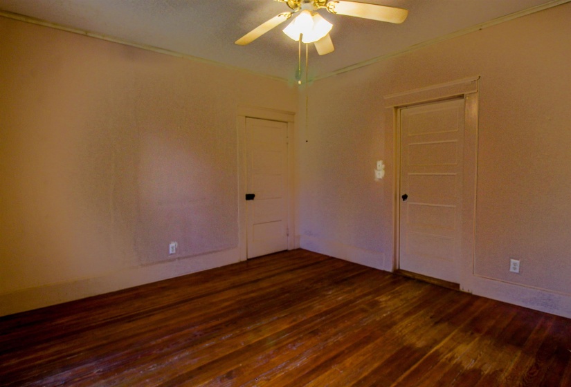 Bedroom featuring original hardwood floors