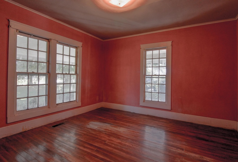 Bedroom featuring original hardwood floors