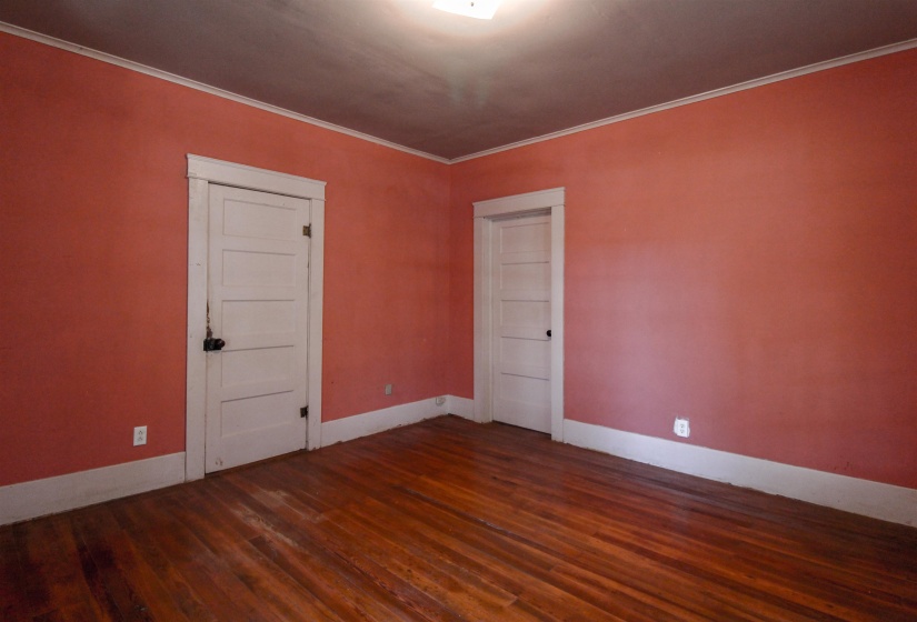 Bedroom featuring original hardwood floors