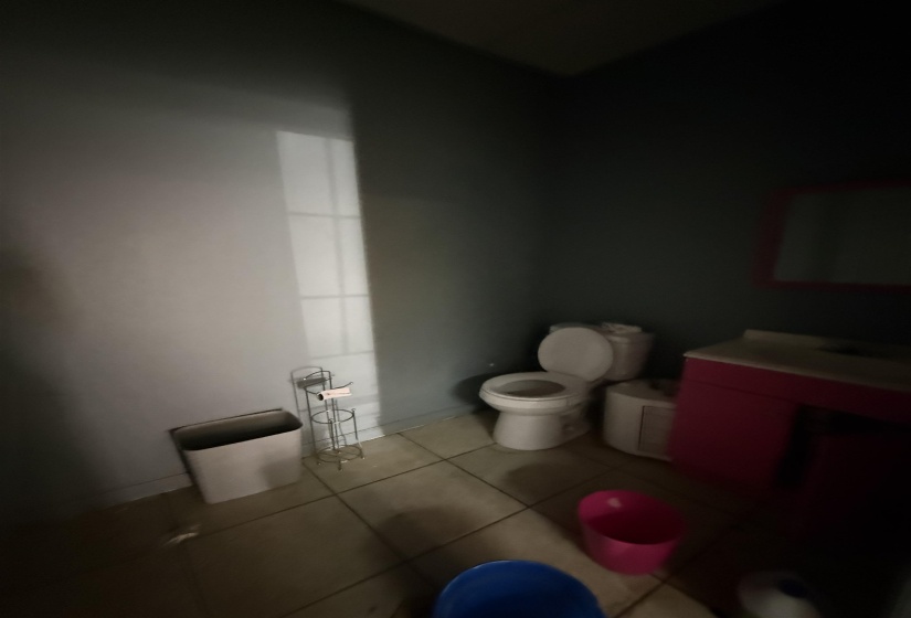 Half bathroom featuring vanity and tile patterned flooring