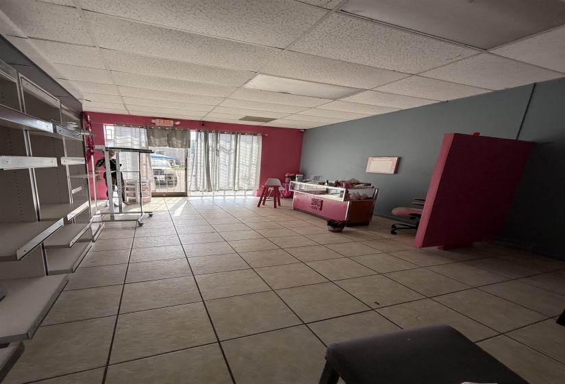 Game room featuring light tile patterned floors and a drop ceiling