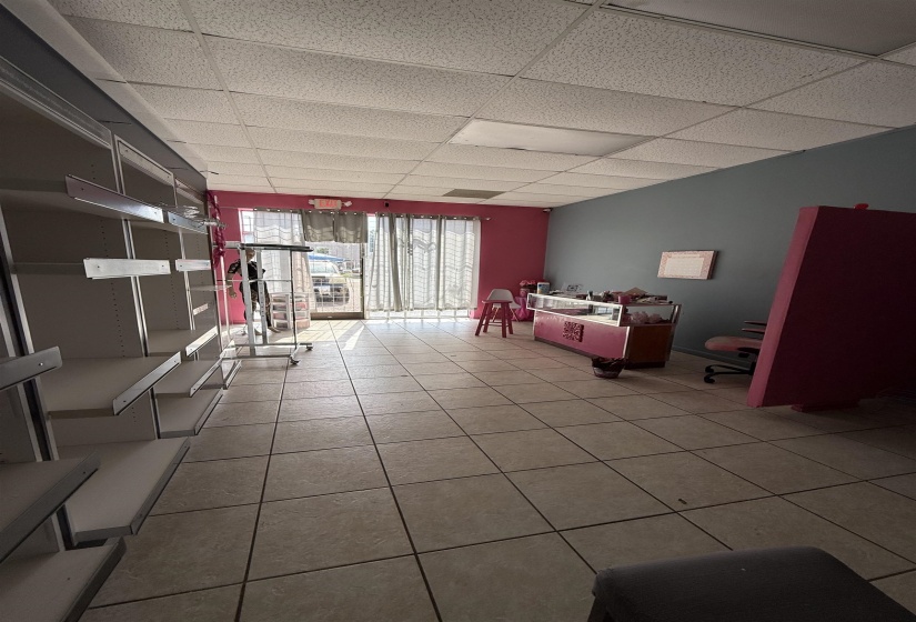 Playroom featuring light tile patterned flooring and a paneled ceiling