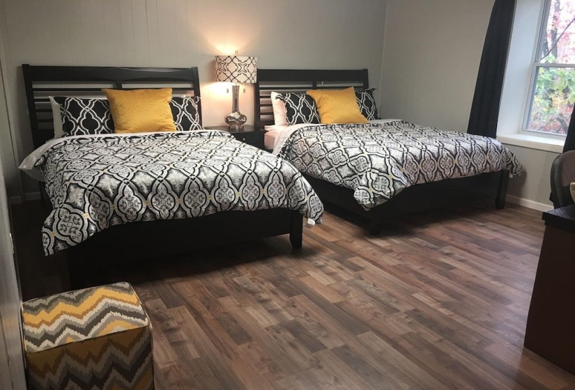Bedroom featuring wood finished floors and baseboards