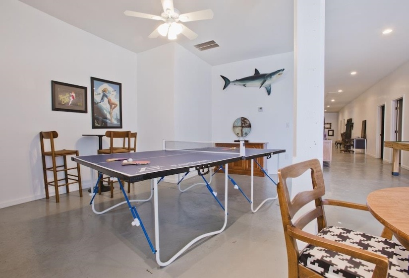 Recreation room featuring concrete flooring, recessed lighting, and ceiling fan