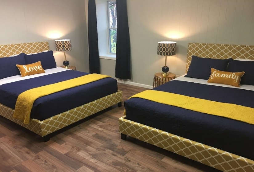 Bedroom with dark wood-style flooring and baseboards