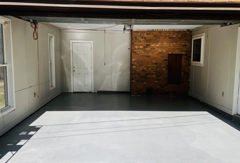 Garage featuring a decorative wall