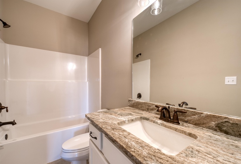 Full bath with bathtub / shower combination and vanity