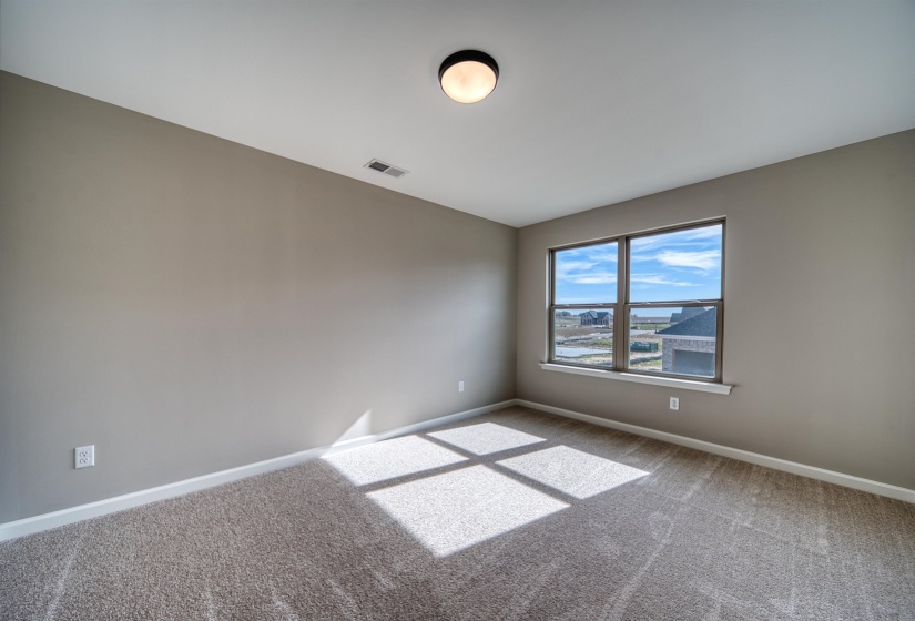Spare room with baseboards and carpet flooring
