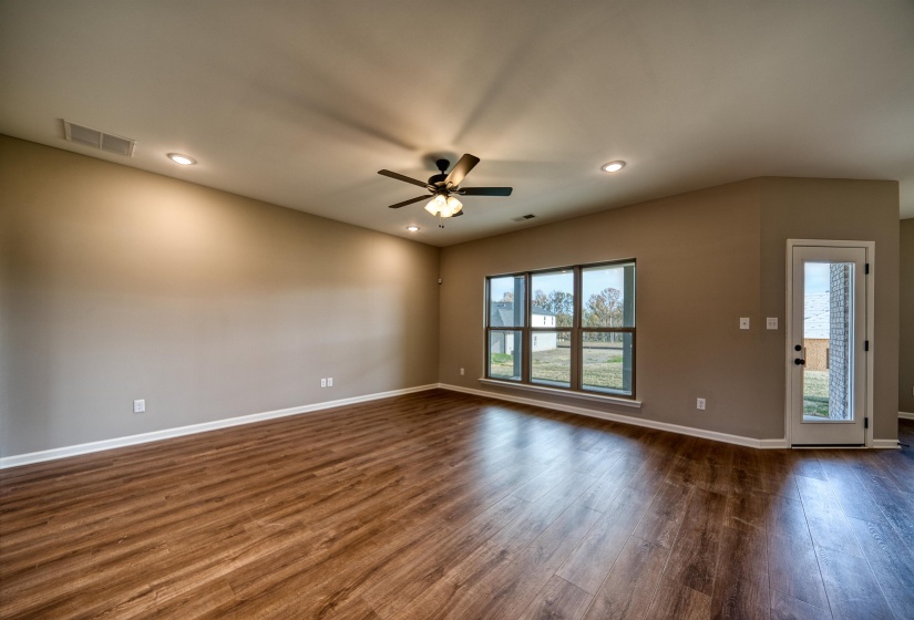 Unfurnished room with recessed lighting, dark wood-style flooring, and a ceiling fan