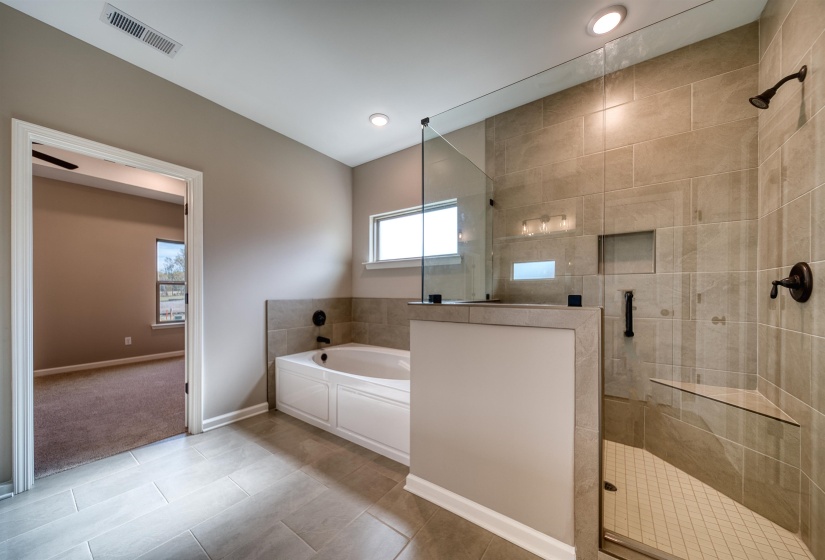 Bathroom with a garden tub, light tile patterned floors, a stall shower, and recessed lighting