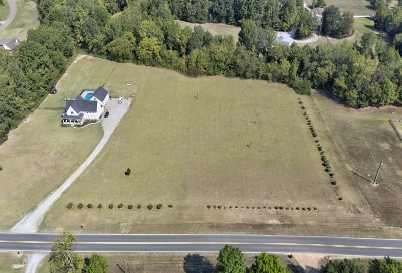 Aerial view of property and surrounding area with rural landscape