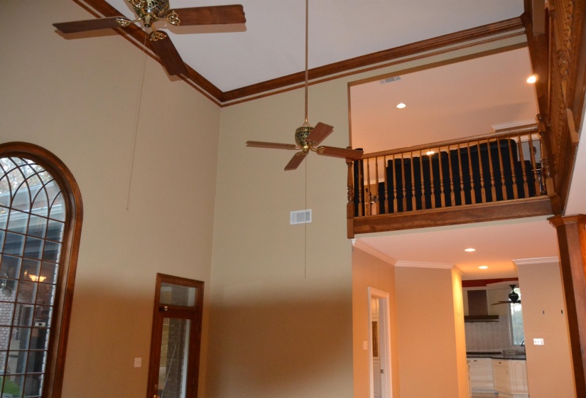 Detailed view of ornamental molding, ceiling fan, recessed lighting