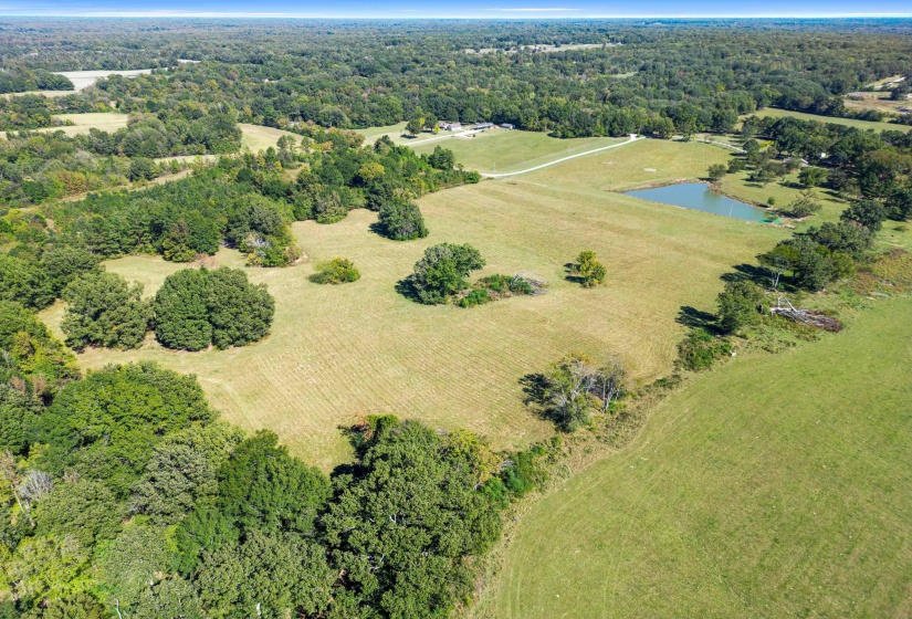 Bask in the quiet majesty of this expanse of open fields touched by clusters of trees and kissed by the Tennessee sun. This land feels alive with potential, offering the perfect blend of natural beauty and peaceful seclusion.