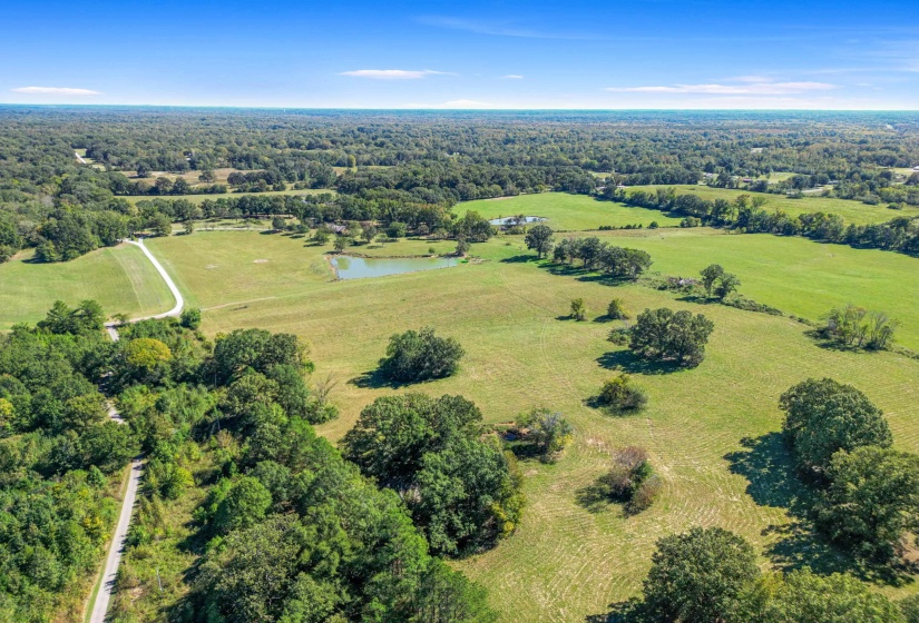 Expansive, open fields stretch out beneath endless blue skies—perfect for breathing in the calm of country life. This property feels miles away from everything, yet is just minutes from Rossville Town Square.