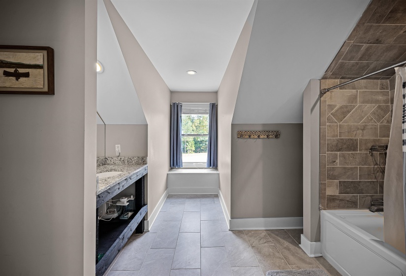 Full bath featuring shower / bath combo with shower curtain, vanity, light tile patterned floors, and recessed lighting