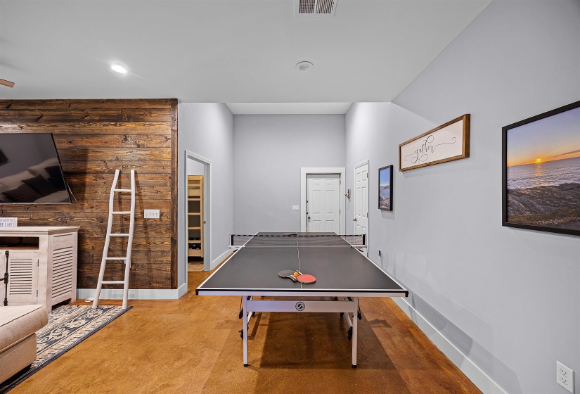 Playroom with recessed lighting and wooden walls