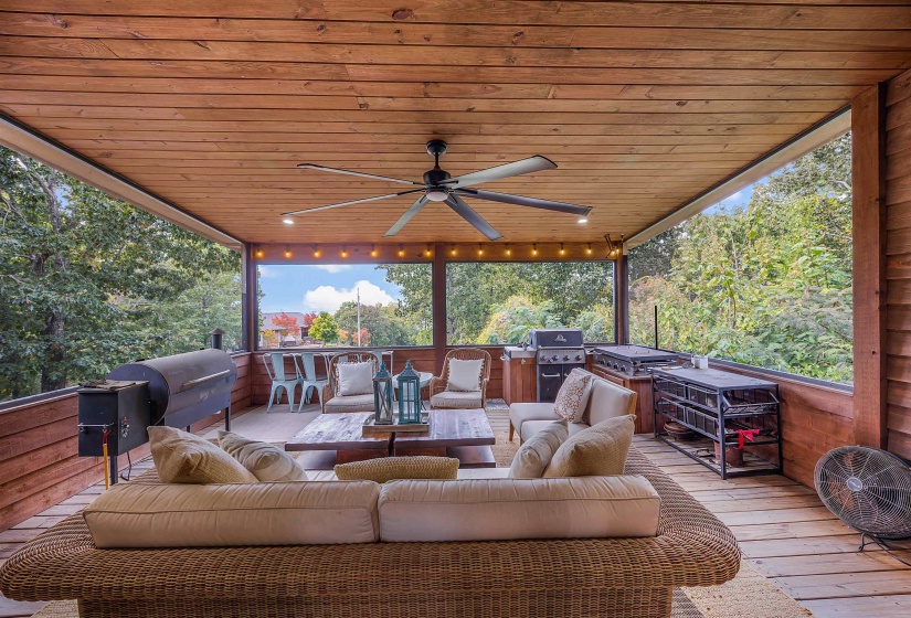 Deck featuring ceiling fan, an outdoor living space, and exterior kitchen