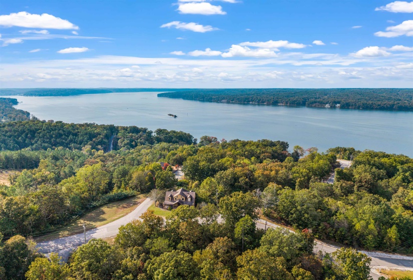 Bird's eye view of a heavily wooded area and a large body of water