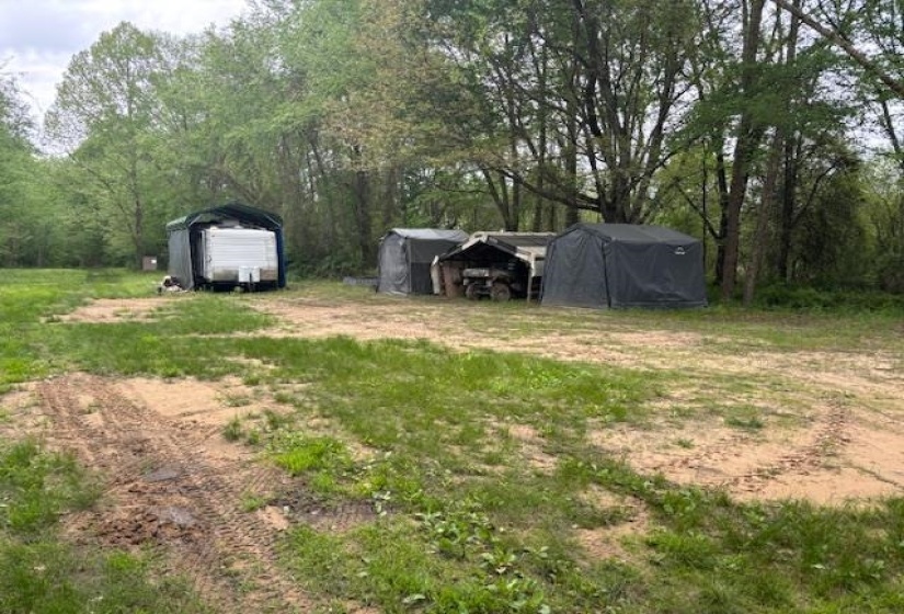 View of yard with a detached carport