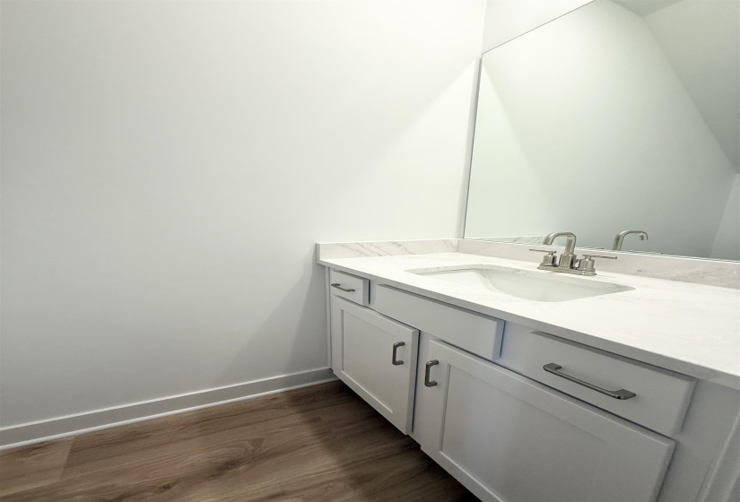 Bathroom with vanity and dark wood finished floors