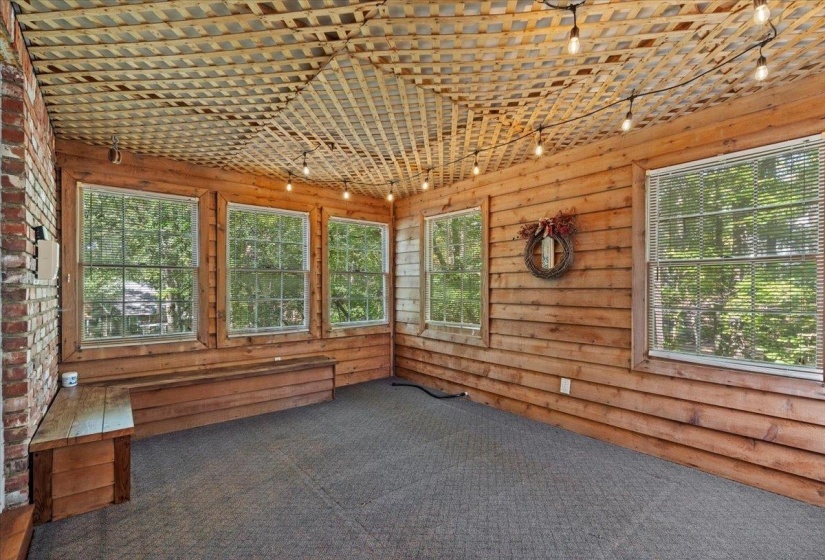 Unfurnished sunroom featuring track lighting