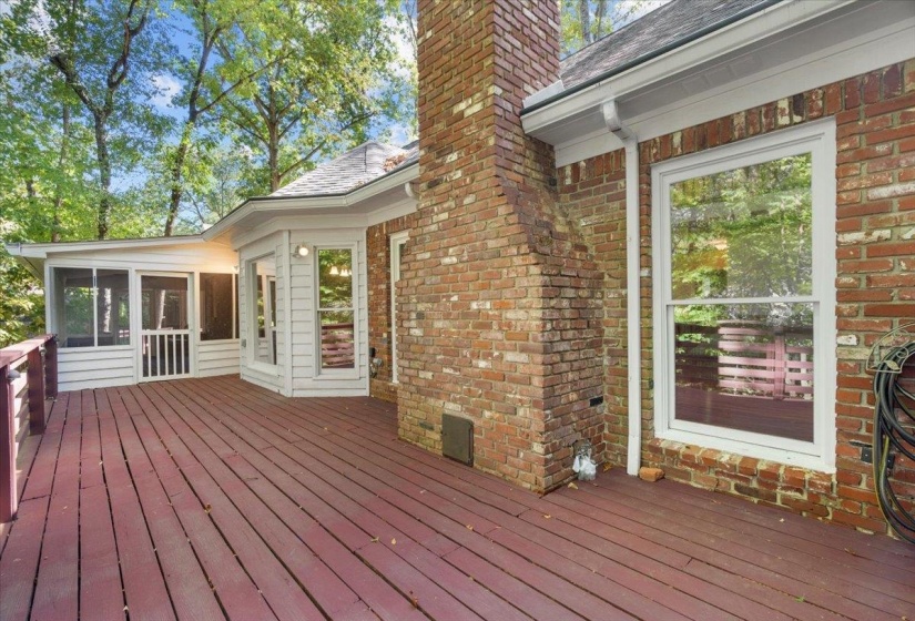 Deck featuring a sunroom
